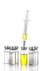 medical ampoules and syringe isolated on white