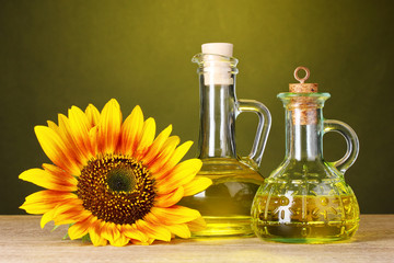 sunflower oil and sunflower on yellow background