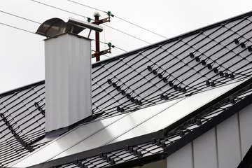 Fotobehang Thermische Solaranlage auf Dach © Magnus
