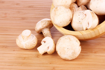 Champignon on wooden background