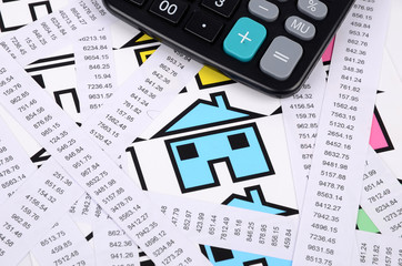 Receipts,calculator and house