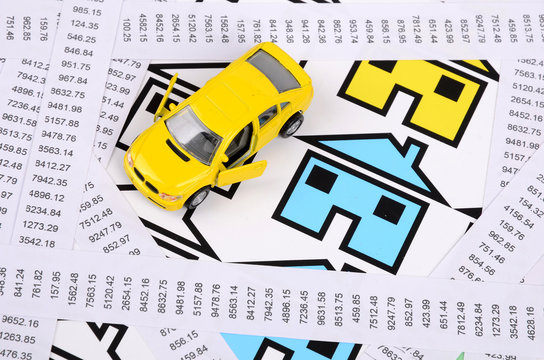 Receipts and house with toy car