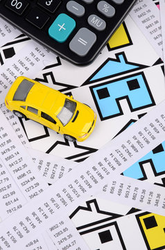 Receipts and house with toy car