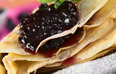 Folded pancake filled with blueberry jam