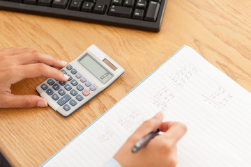 Feminine hands making reporting