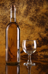 White wine with glass against colorful background