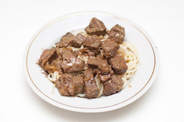 Spaghetti with liver on white background