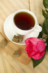 A cup of tea and rose