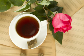 A cup of tea and rose