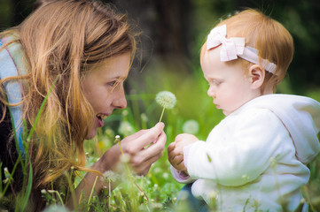 Young mother with little baby at the park