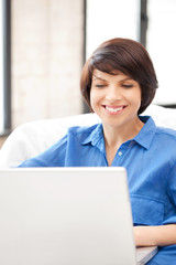 happy woman with laptop computer