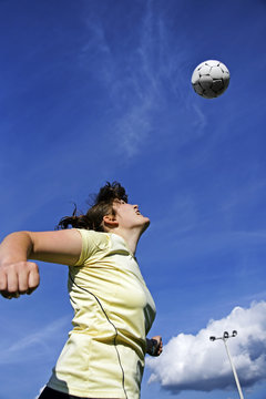 Woman Soccer Or Football Player Header