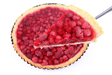 Raspberry Tart in a tart pan, a portion cut out