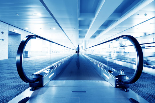 A passenger on the escalator