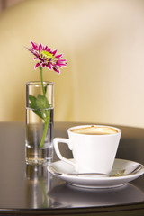 Cup of coffee with flowers