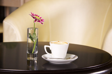 Cup of coffee with flowers