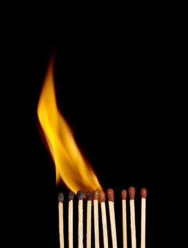 Row of matches burning