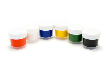 A set of colored paints in transparent plastic containers.