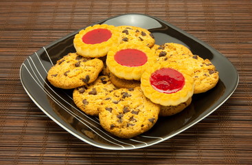 plate of cookies on dark brown background