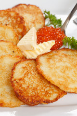 fried potatoes pancakes with caviar