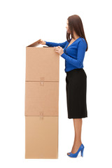 attractive businesswoman with big boxes