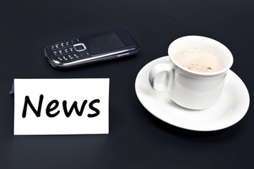 News message on desk with coffee