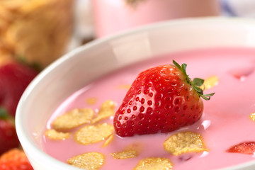 Strawberry yogurt with fresh strawberry and corn flakes