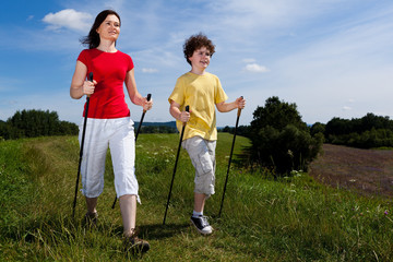 Nordic walking - mother and son outdoor