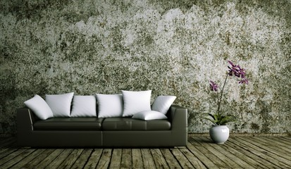 Wohndesign - Ledersofa vor Betonwand