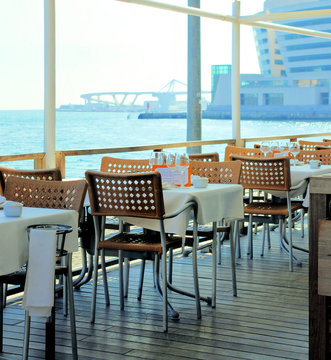 restaurant on a terrace c a kind on a marina, quay Port Well, ba