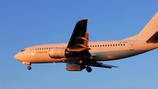 Landing of airplane, sunset scene, Corfu airport, Greece