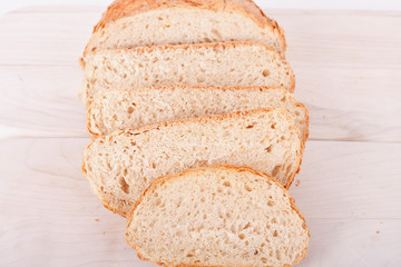 Sliced Loaf of Whole Grain Bread on Cutting Board Closeup