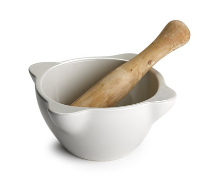 White mortar and wooden pestle isolated on white
