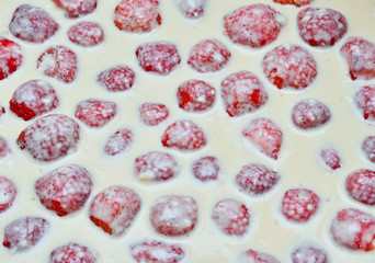 a dessert a lot of strawberry in  milk