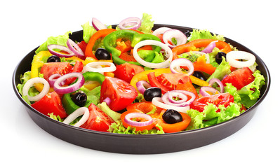 many vegetables in a pan isolated on white