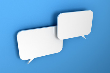 Two speech bubbles in front of a blue, textured wall