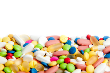Fototapeta na wymiar pills over white. Colorful tablets with capsules.