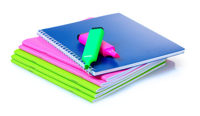 bright notebooks and markers isolated on white