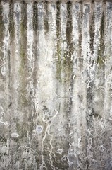 Fototapeta premium Water erosion of the concrete wall