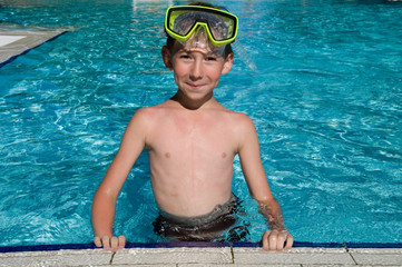 cute boy in a swimming pool © tashka2000