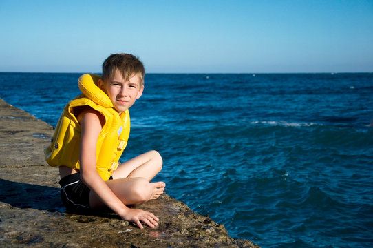 Boy In Yellow Life Jacket