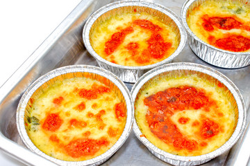 Baked spinach with cheese, studio shot