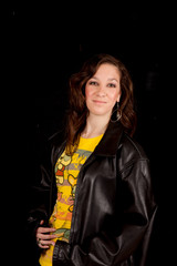brunette girl in black leather jacket, smiling