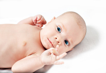 Picture of the newborn resting on a bed
