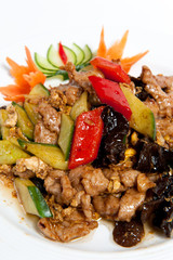 Roasted pork with vegetables on a plate