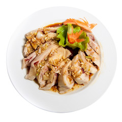 Roasted hen in sauce on a plate