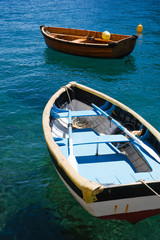 Two fishing boats in clear blue water