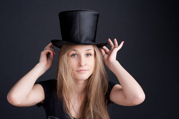 beautiful smiling girl in a black hat