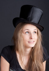 beautiful smiling girl in a black hat