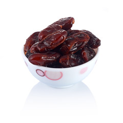 A dish of dates isolated on white background